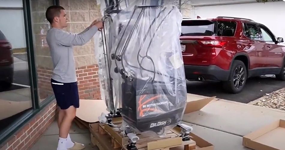 Dr. Dish machine being unpacked after delivery